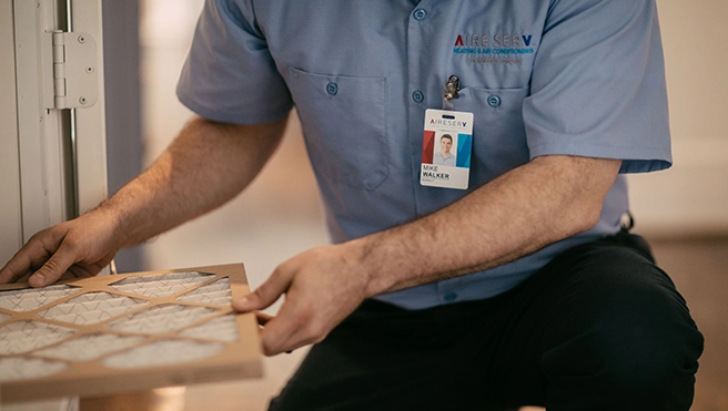 An asv technician explaining services to client.