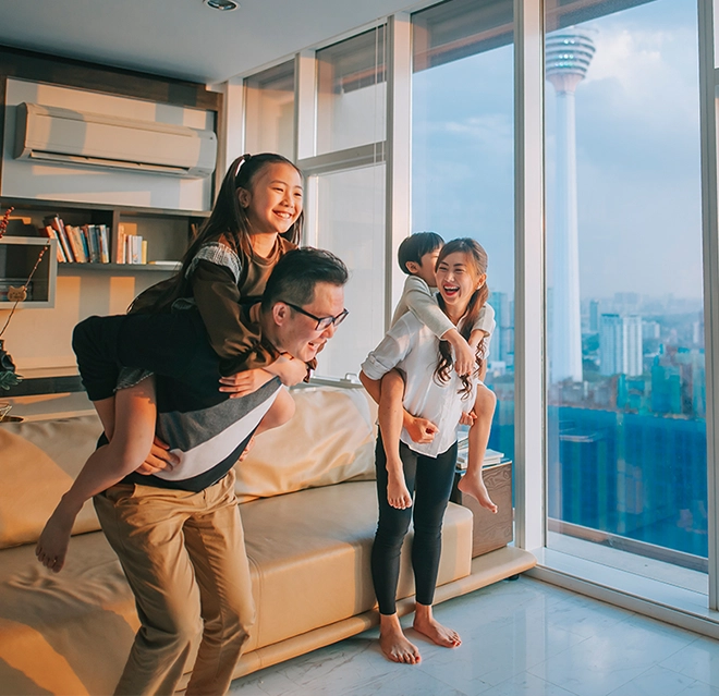 A family playing near the window at the living room.