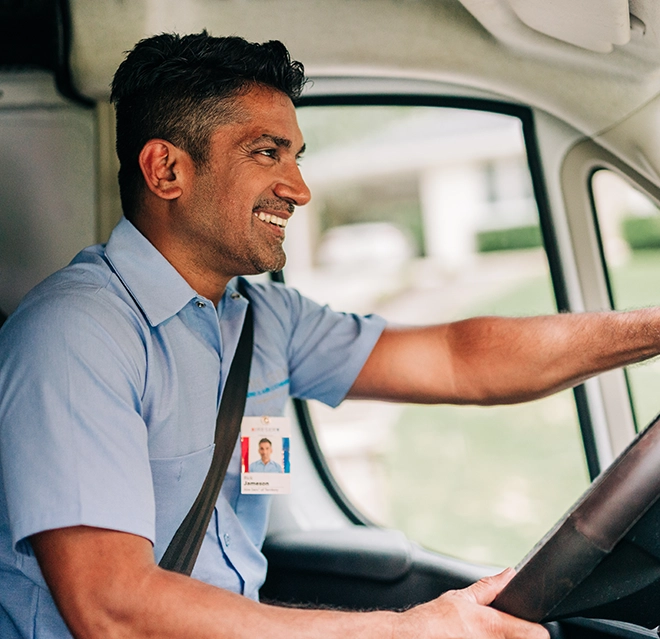 Aire Serv technician driving the brand van.