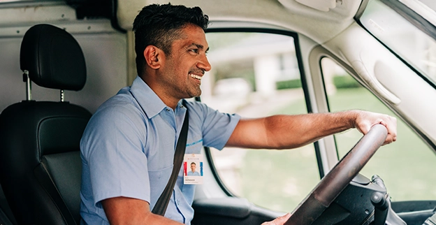 ASV technician driving van to the customers location.
