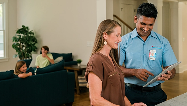ASV technician explaining services to a customer.