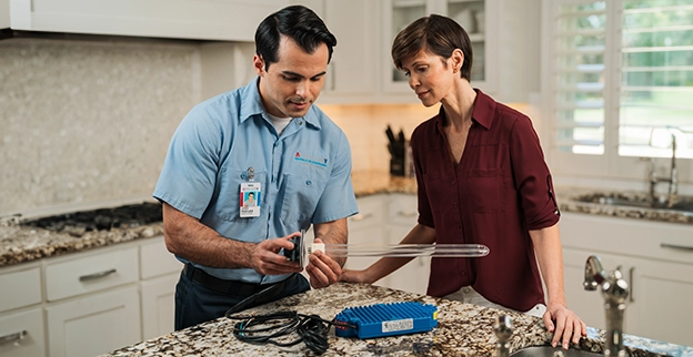 An asv technician explaining repairs to the client.