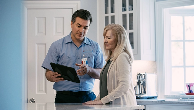 Aire Serv technician explaining geothermal systems.