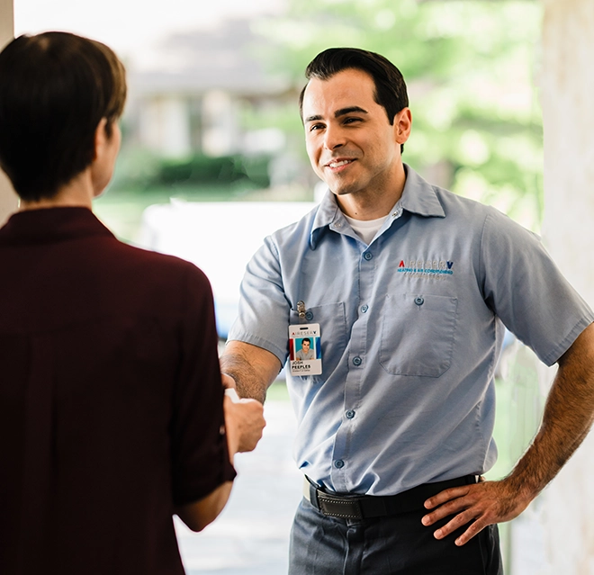 Aire Serv technician greeting the customer.