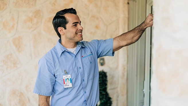 Aire Serv technician knocking on the door.