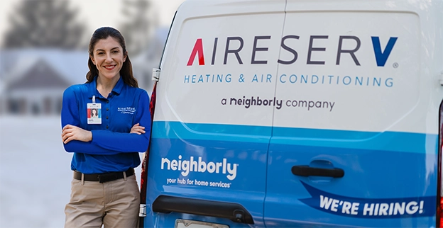 Aire Serv technician near the brand van.