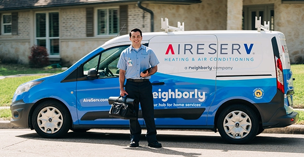 Aire Serv technician with van and tool bag.