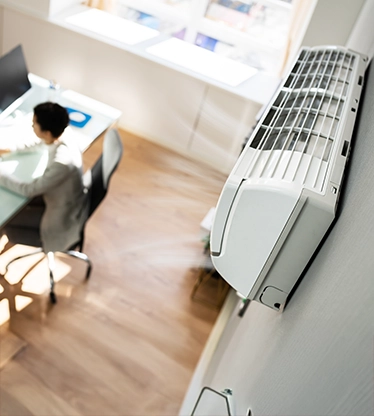Close-up of wall mounted air conditioner in an office.
