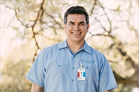 Smiling ASV technician arriving at the location.