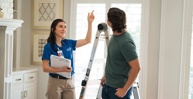 ASV technician explaining air vent services.