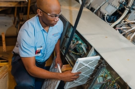 ASV technician working on the air filters.