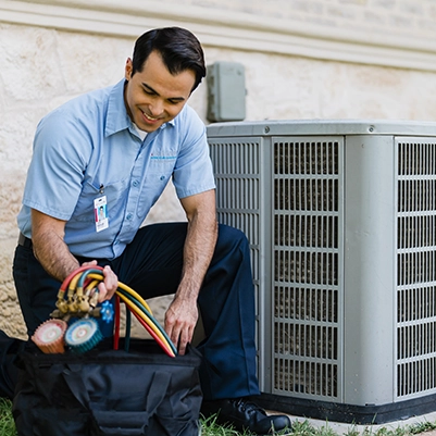 Aire Serv tech checking evaporator.