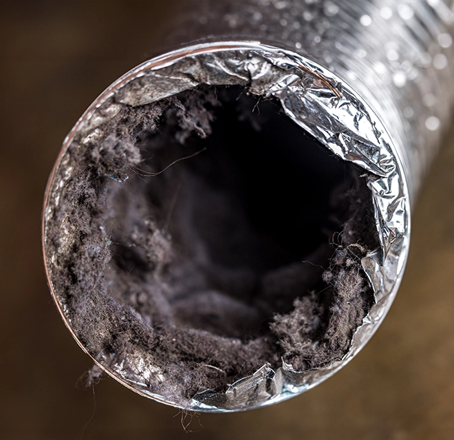 A picture of a clogged dryer vent.