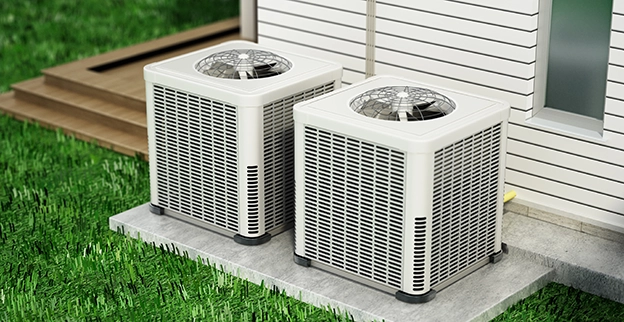 A pair of air conditioning units side by side.