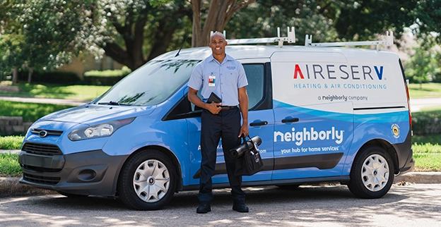 Technician near a van.