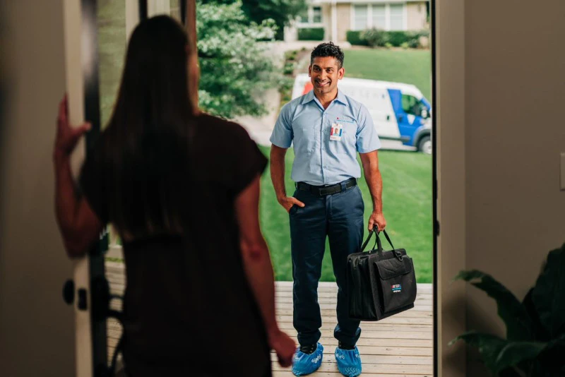 Aire Serv technician working on a customer's water heater.