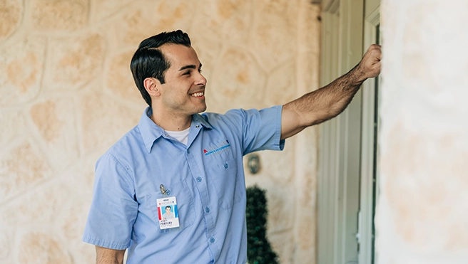 Aire Serv technician knocking on door.