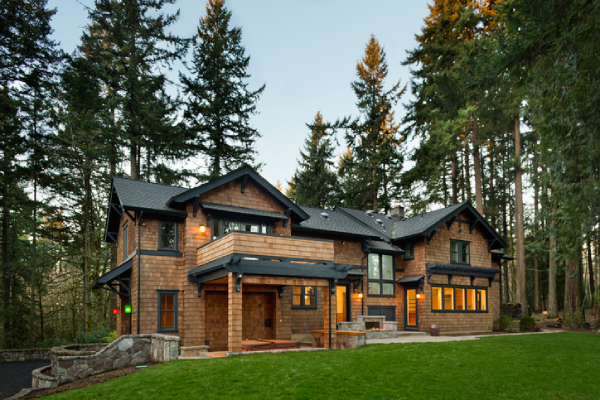A large house sits amidst pine trees in the evening light. | Aire Serv&reg; of North Central Arizona.