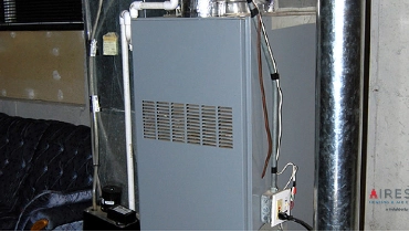 Old furnace next to sofa