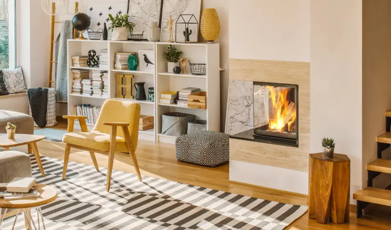 Stylish living room with lit fireplace