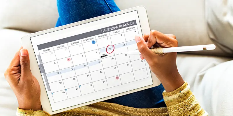 Person on tablet looking at calendar