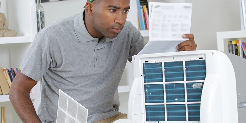 Man working with HEPA filter