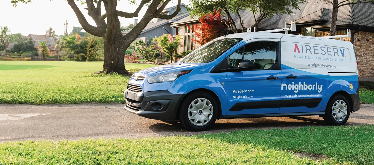 Aire Serv van parked at a customers home.